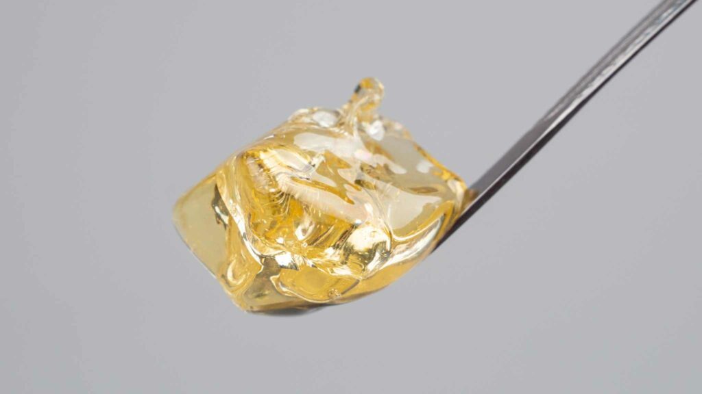an image of a small dose of cannabis concentrate on the end of a dabber