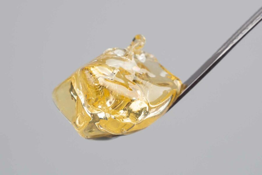 an image of a small dose of cannabis concentrate on the end of a dabber
