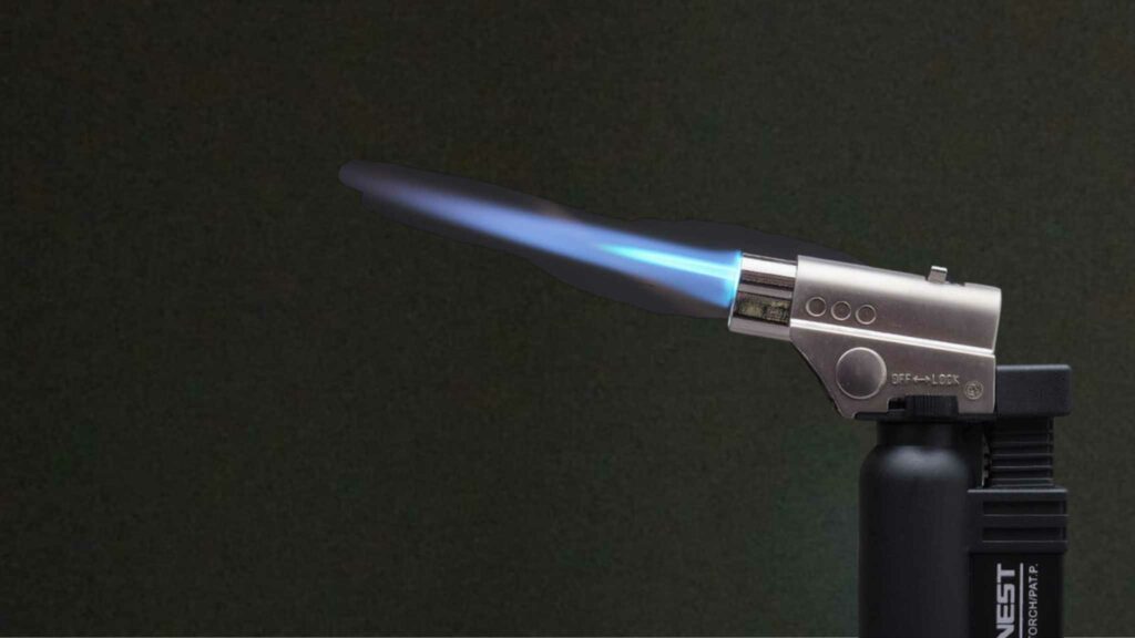 Image of a torch lighter being fired